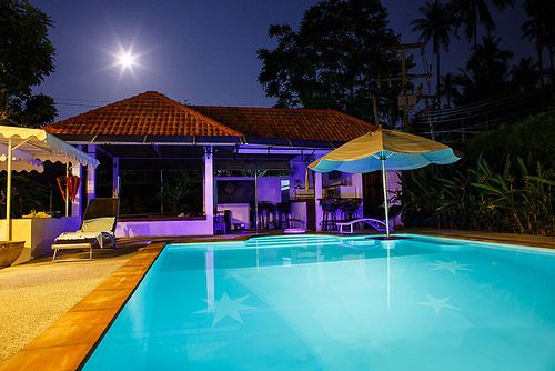 Villa with pool at night