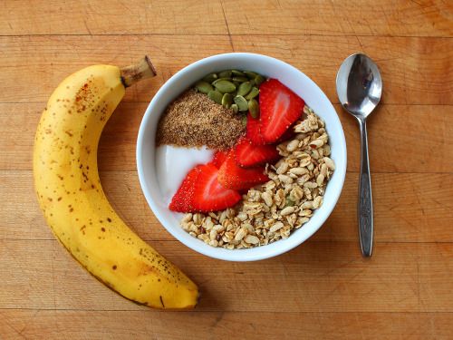 garden-of-vegan: A banana and unsweetened coconut yogurt topped with pumpkin seeds, ground flax seed, strawberries, and pumpkin flax granola.