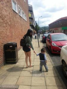 mother and son, Hand in Hand walking on the street