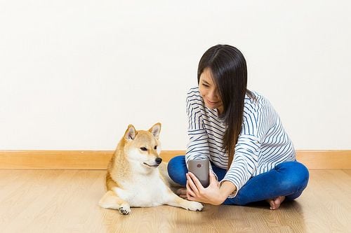 Asia woman and dog selfie