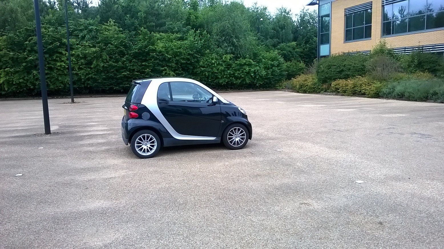 My boss drives this tiny car and he is the head of software :)  easy to park and saves fuel, why not?, head-of-software-drives-this-tiny-car.jpg [Cars and Automotive]