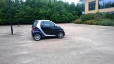 My boss drives this tiny car and he is the head of software :)  easy to park and saves fuel, why not?