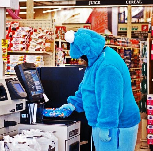 blue monster using checkout machine in supermarketâ¦
