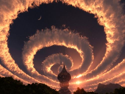 wasbella102: Cloud spiral in the sky. An Iridescent (Rainbow) Cloud in Himalaya. The phenomenon was observed early am 18 Oct 2009